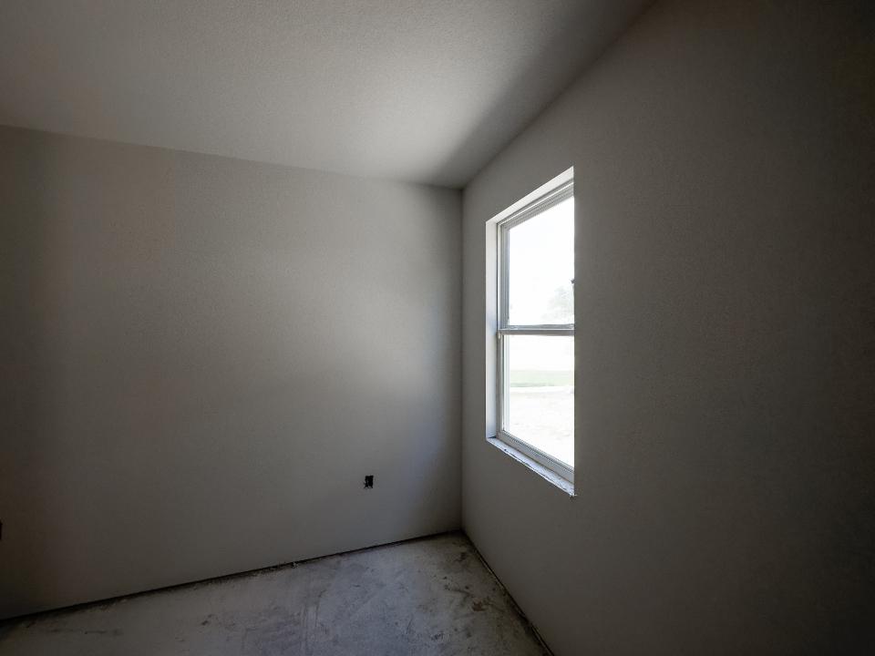 An empty room part way through a job, walls prepped