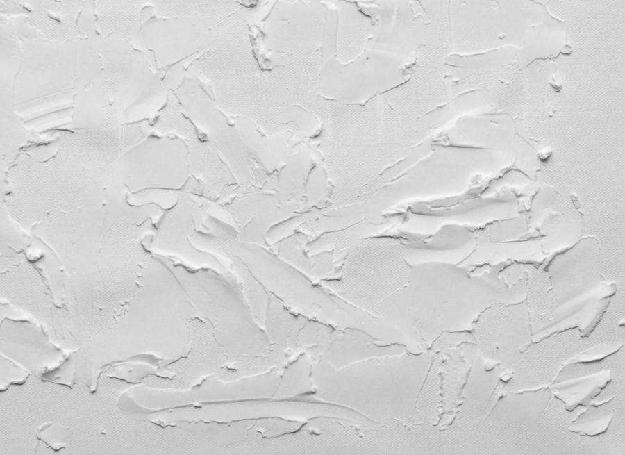 Fresh plaster texture worked across a repaired wall